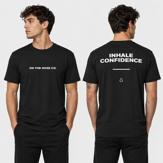 Black t-shirt with text on front and back worn by a person, on a white background